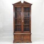 An oak bookcase, with a glazed upper section, 106cm.