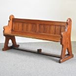 A Victorian carved pine pew,