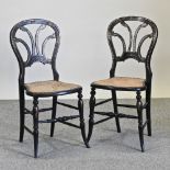 A pair of 19th century mother of pearl inlaid black lacquered side chairs,