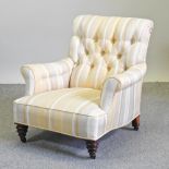 A Victorian Howard style cream striped upholstered armchair