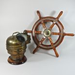 A brass cased ship's gimbal, together with a ship's wheel,