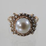A 14 carat ladies pearl cluster ring, set with graduated rows of pearls,