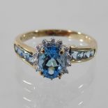 A 9 carat blue topaz and diamond ring,