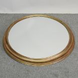 An oval gilt framed wall mirror,