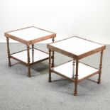 A pair of mirrored glass two tier occasional tables,