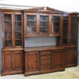 A good quality oak glazed bookcase, of large proportions, 320cm wide x 246cm high 70cm deep.