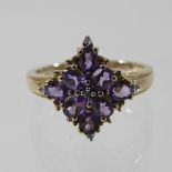 A 9 carat gold amethyst and diamond ring,