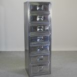 A modern metal narrow chest of seven drawers,