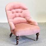 A Victorian pink upholstered nursing chair