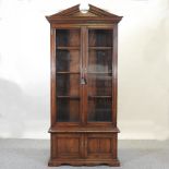 An oak bookcase, with a glazed upper section, 106cm.