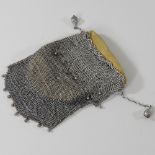 A silver mesh purse, with suede lining,