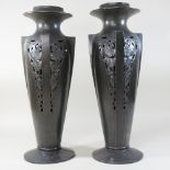 A pair of Art Nouveau German pewter vases, with stylised foliate decoration,