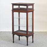 A 19th century bijouterie cabinet, on square tapered legs,