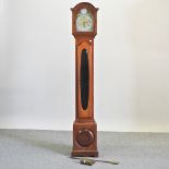 A 1930's walnut cased grandmother clock, with Westminster chimes, and sprung movement.