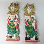 A near pair of Thai painted wooden figural wall panels,