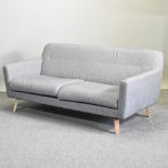A contemporary grey upholstered sofa, from John Lewis,