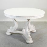 A Victorian cream painted circular dining table,