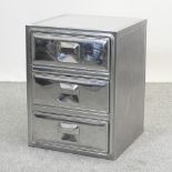 A metal three drawer cabinet,
