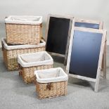 A set of four rope handled wicker baskets, largest 64cm,