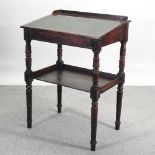 A Victorian mahogany clerk's desk, on turned legs,
