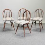 A set of four Ercol dining chairs,