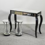A mirrored glass side table, with two drawers, on cabriole legs, 101cm,