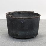 A black painted metal cauldron,
