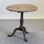 A 19th century oak tilt top occasional table,