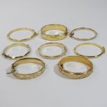 A collection of eight various gold plated ladies bangles (8)