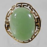 A 9 carat gold and jade coloured cabochon set ring