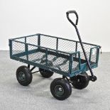 A new green painted metal garden trolley,