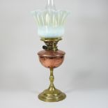 An Arts and Crafts brass oil lamp, by WAS Benson, stamped marks, with a vaseline glass shade,