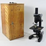 A 20th century microscope, in a wooden box,