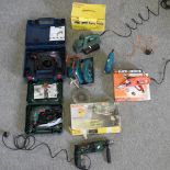 A collection of electric tools, to include two drills, cased, a Bosch plane, a hedge trimmer,