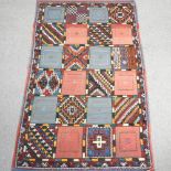 A Moroccan rug, with all over geometric designs,