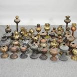 A large collection of oil lamps,