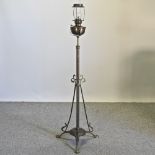 An early 20th century brass telescopic standard lamp and shade