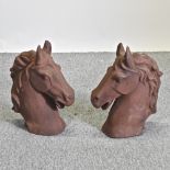A pair of metal horse head gatepost finials,
