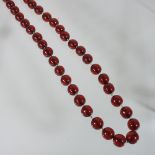 A cherry amber coloured bead necklace