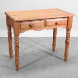 A pine side table, on turned legs,