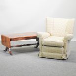 A modern gold check upholstered armchair, together with a reproduction drop leaf coffee table,