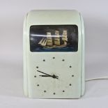 A 1930's white bakelite cased electric Vitascope automaton clock, inset with a three masted ship,