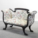 A continental mahogany floral upholstered scroll end sofa, on sabre legs,