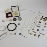 A collection of 19th century and later jewellery, to include a fox stock pin, a tie pin,