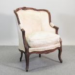An early 20th century French style cream upholstered fauteuil