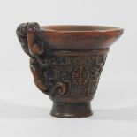 A reproduction Chinese carved resin libation cup,
