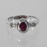 An 18 carat gold ruby and diamond dress ring,