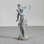 A metal garden statue of a fairy,
