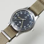An Omega military vintage wristwatch, circa 1953, with a signed black dial,