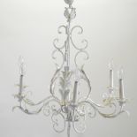 A modern white painted metal six branch chandelier, with scrolled decoration,